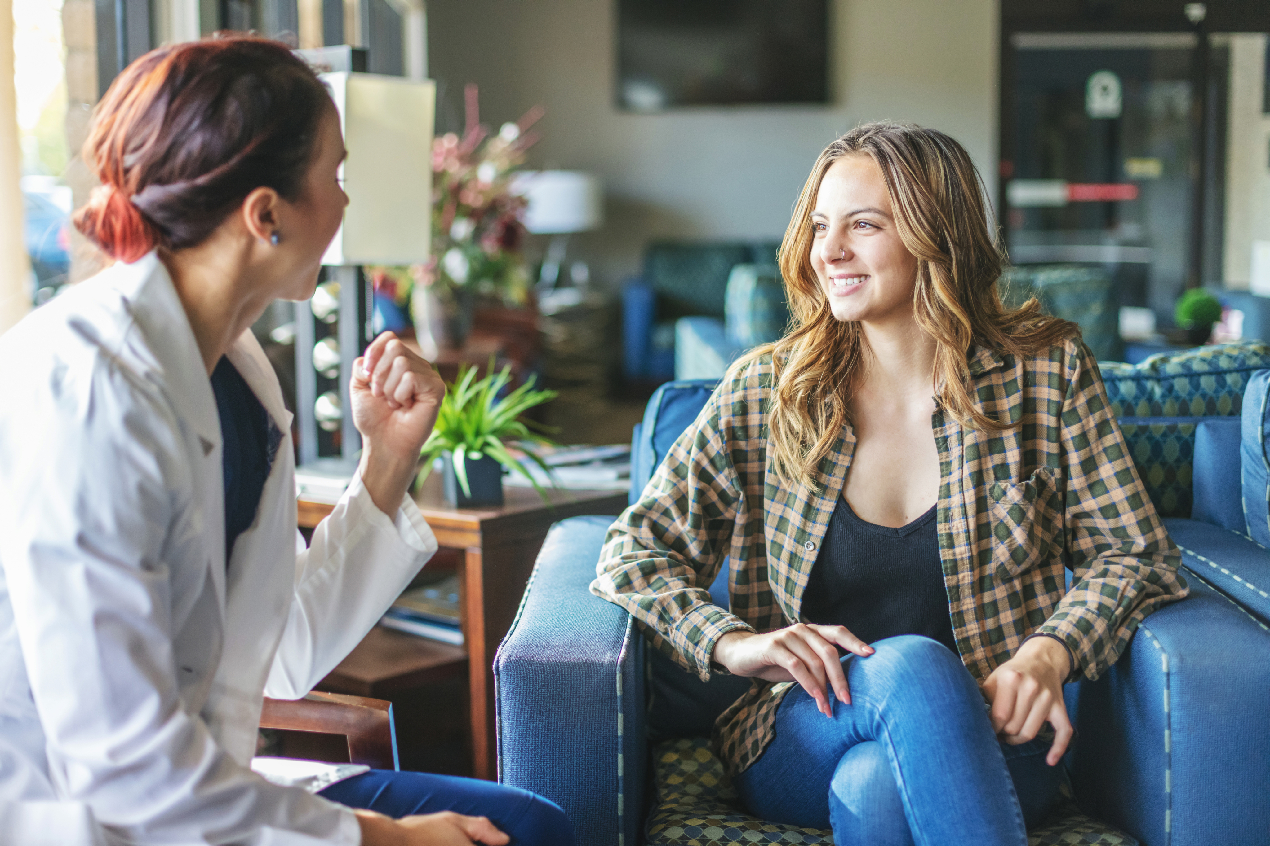 woman talking to eye care professional