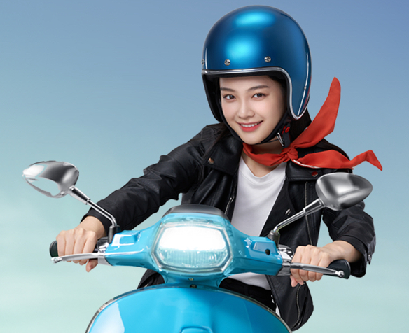 woman riding a blue moped smiling while wearing blue helmet and black leather jacket