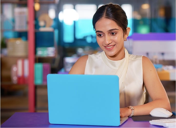 Smiling woman with laptop